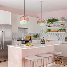 Pink Open Plan Kitchen With Green Pendants