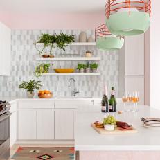 Pink Contemporary Kitchen With Orange Pendants