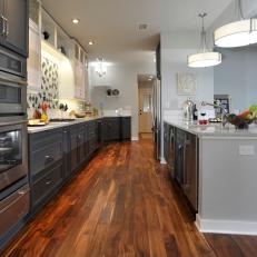 Gray Galley Kitchen With Hardwood Floor