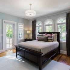 Transitional Blue Bedroom With Arched Windows