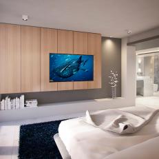 Modern Master Bedroom With Blue TV