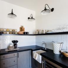 Butler's Pantry With Black Countertops