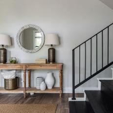 Contemporary Foyer With Black Stairs