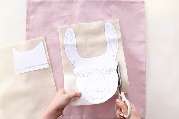 Pin the llama shape onto cream felt and cut it out. You may have to cut out the head and neck separately depending on the size of your felt.