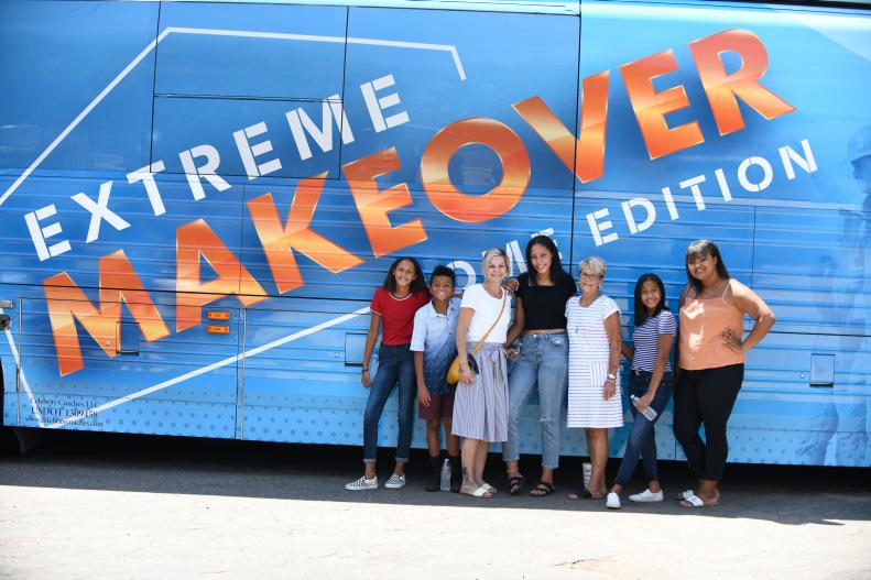 The Mosely Family of Bakersfield, California poses in front of the Extreme Makeover bus. Left to right: Annie, Miguel, Jessica, Makynzie, Pamela (Chapin), Jordyn, and Cheyenne