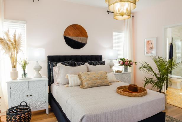 Jessica Mosley no longer has to share a bed with her mother Pamela in her own, classy boho inspired master bedroom. Breegan gave Jessica a restful adult-zone sanctuary for this busy mother of 5 to unwind.  Jessica's walls are palest blush paint paired with black velvet headboard, custom fiber art wall hanging and gold lantern chandelier.