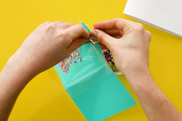 Use this same method to make a notebook by sewing one side of a page protector to folded scrapbook paper. Fill with confetti and sew closed. Cut and fold the paper to fit inside and staple your notebook together.