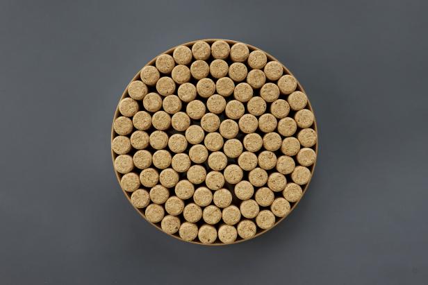 Figure out how many wine corks will fit in your tray. Our 10¼” round tray fit 91 corks.