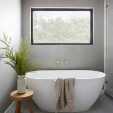 Gray Master Bathroom With Oval Tub
