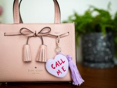 Purse With Heart Keychain That Says "Call Me"