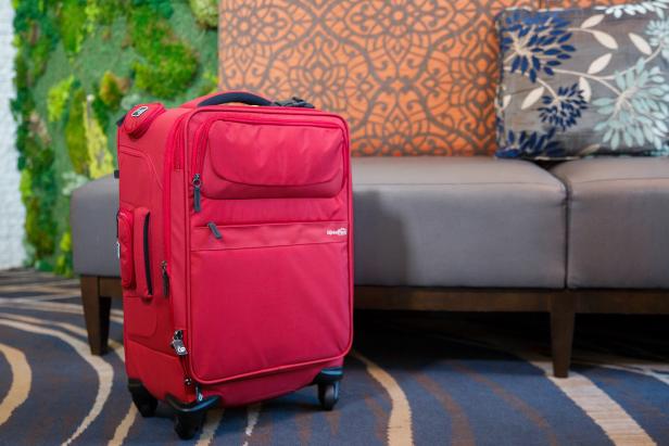 Red Suitcase in Airport or Hotel Lobby