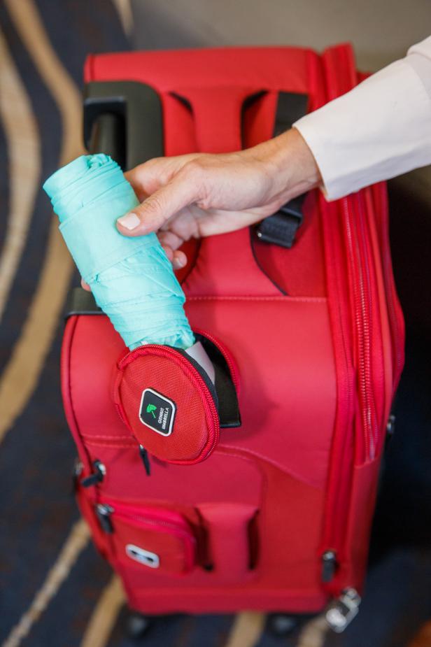 The Genius Pack suitcase keeps everything you're traveling with neatly organized and within easy reach, including an umbrella.