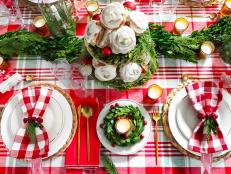 Red is a quintessential Christmas color. Paired with gold accents, berries and wreaths, it adds seasonal cheer to create an inviting table for your guests.