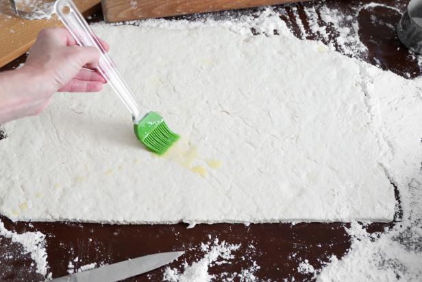 Roll the dough out using a floured rolling pin to approximately 11x17. For the filling, brush the dough with the melted butter.