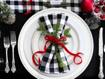 Silver accents, such as platinum-edged china and gleaming chargers, enhance the crisp winter color scheme of black and red. The Christmas holiday is also a perfect opportunity to incorporate sentimental heirloom pieces such as Grandmother’s silver.  