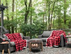 As temperatures start to drop, think of fresh ways to add autumnal and wintry charm to your outdoor spaces. This woodsy retreat is extra dreamy in the winter, and its fire pit is paired with comfy loveseats for lounge-like hangouts.