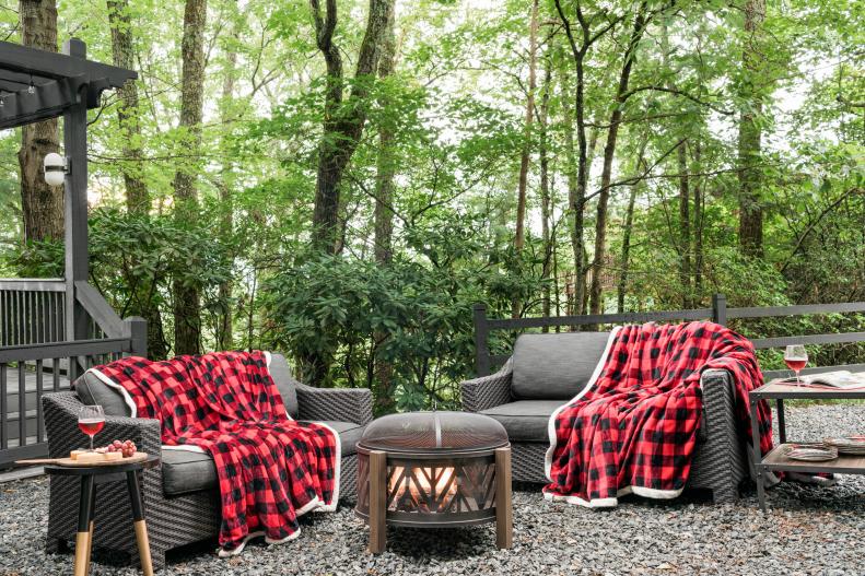 As temperatures start to drop, think of fresh ways to add autumnal and wintry charm to your outdoor spaces. This woodsy retreat is extra dreamy in the winter, and its fire pit is paired with comfy loveseats for lounge-like hangouts.