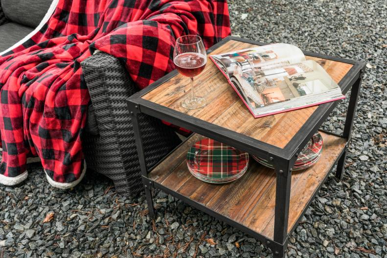 For spaces in which a fire pit will get heavy usage during the colder months, choosing outdoor furniture that can withstand a lot of wear and tear is key. This rustic end table is made from pressure-treated pine and industrial steel, two tough materials which can stand up to bumps and scrapes and also all types of weather.