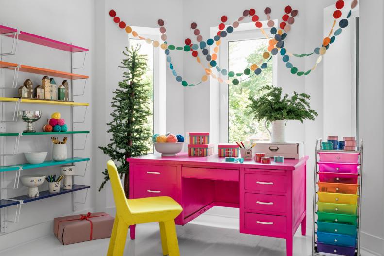 This gift wrapping studio space puts a brand new spin on Christmastime colors. It's decorated from floor to ceiling with highly saturated tones, putting a pop art spin on seasonal decor.