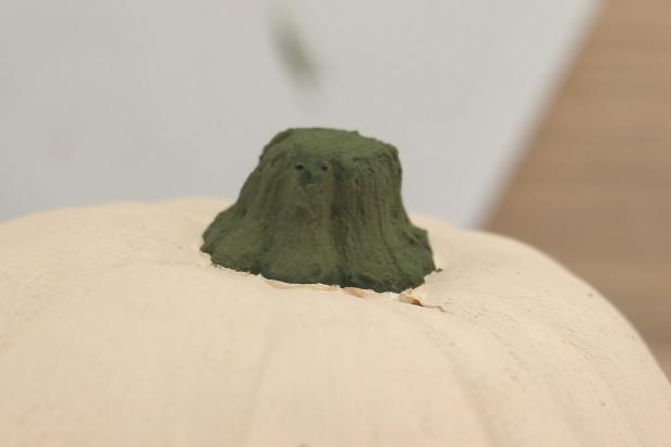 Paint the stem of the pumpkin with a paint & baking powder mixture, which will add extra texture.