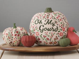 Two White Pumpkins with Flowers, Two Ornage Gourds and a Green Pumpkin