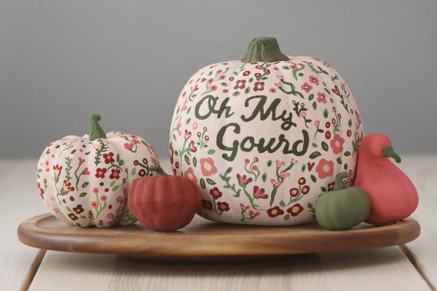 Two White Pumpkins with Flowers, Two Ornage Gourds and a Green Pumpkin