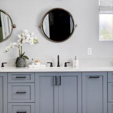 Blue and White Contemporary Master Bath With Round Mirrors and Black Hardware 