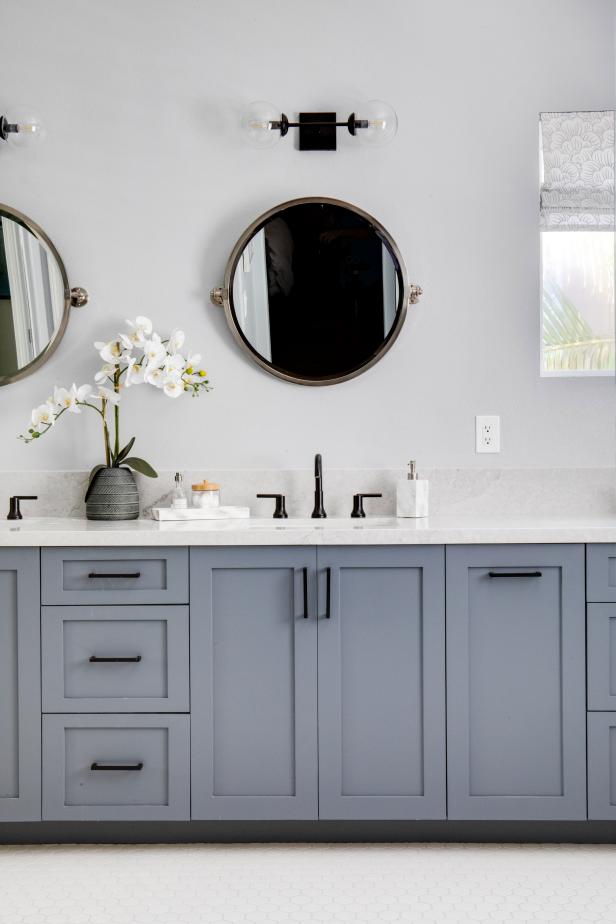 Blue and White Contemporary Master Bath With Round Mirrors and Black ...