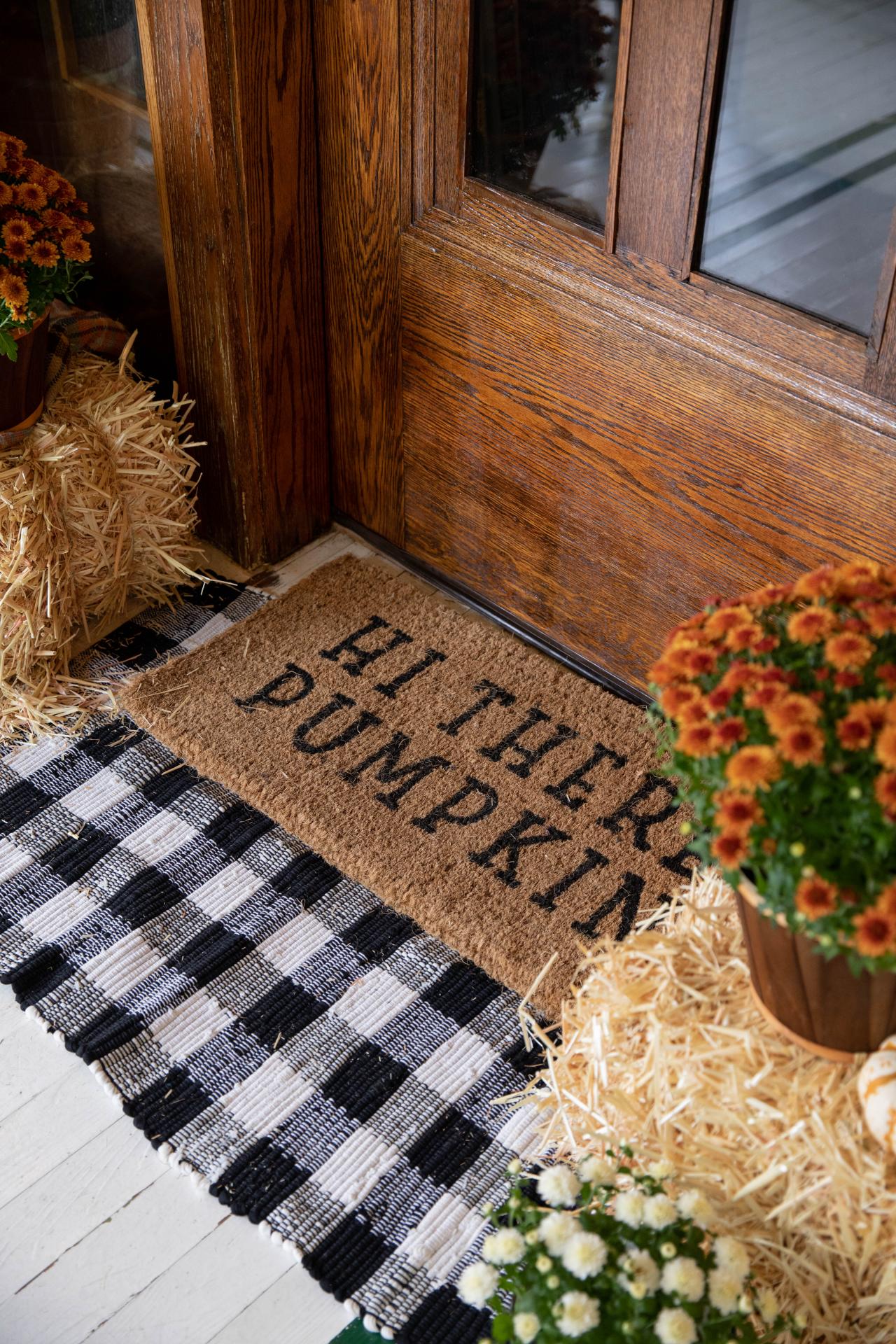 fall doormat with plaid underlay. Fall decor ideas for your porch.