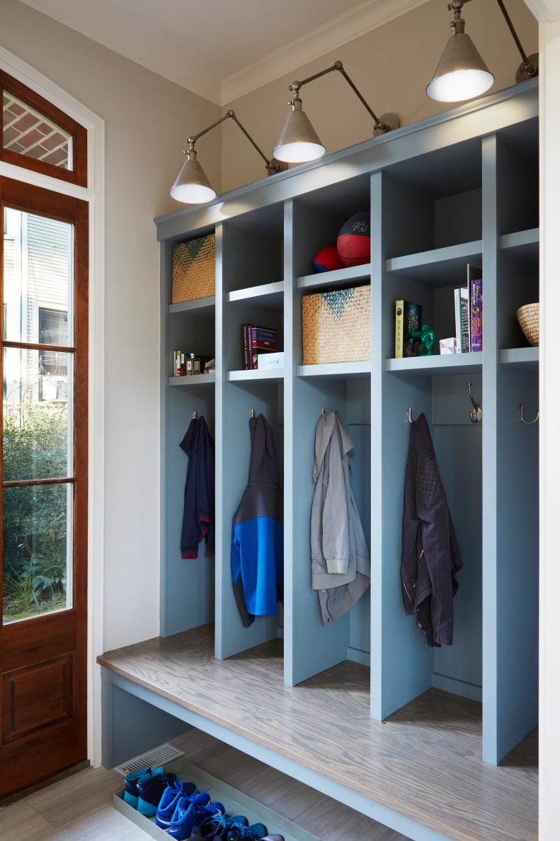 This renovated mudroom features blue cubby storage.