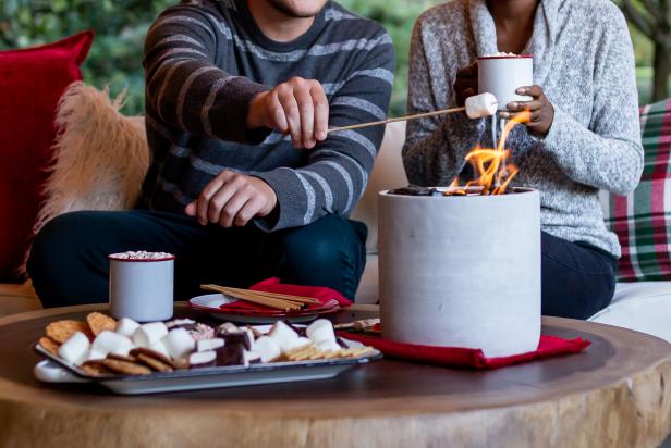 This DIY tabletop fireplace is made out of a cement planter that has been filled with lava rocks. The fire is fueled by fire gel containers that put off a surprising amount of heat. The DIY is a great way to make your porch more fun and gives you the options to roast marshmallows anytime.