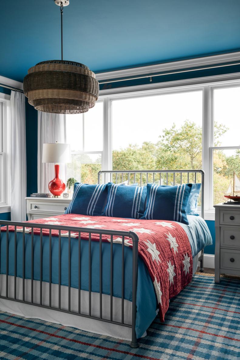 Blue Country Bedroom With Red Lamp