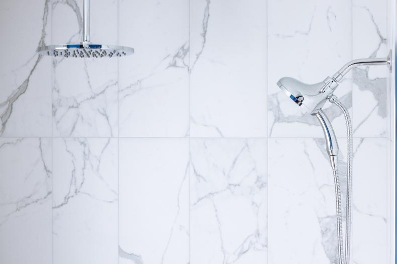 With a waterproof design and on-trend style, the 24-by-24-inch Bianca Carrara porcelain tiles used for the shower walls mimic the look of marble, but offer more durability and versatility. 