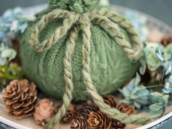 Cozy up a plain pumpkin with an old or thrifted sweater!  It’ll bring amazing texture to any fall arrangement.