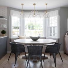 Gray Transitional Dining Area With Sculptural Pendants