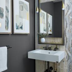 Gray and Gold Powder Room With Stone Wall