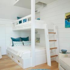 Blue and White Coastal Bunk Bedroom WIth Blue Rug