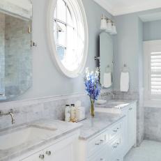 Blue Transitional Bathroom With Round Window