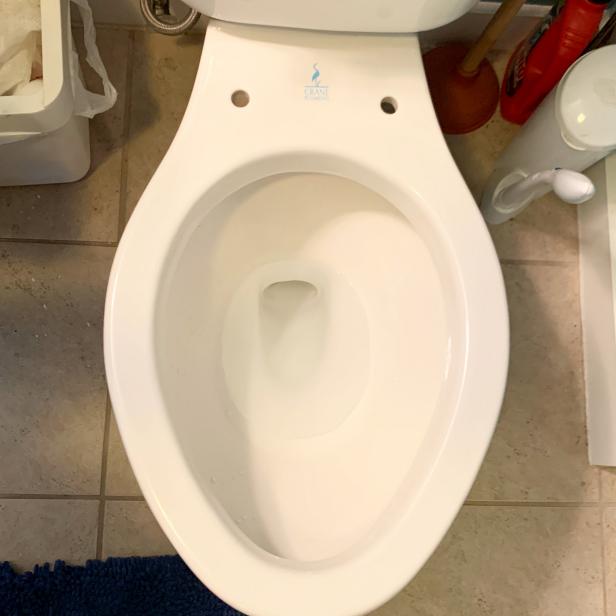 After turning off the water supply, the first step to set up a TUSHY Classic bidet seat attachment is to remove your toilet seat.