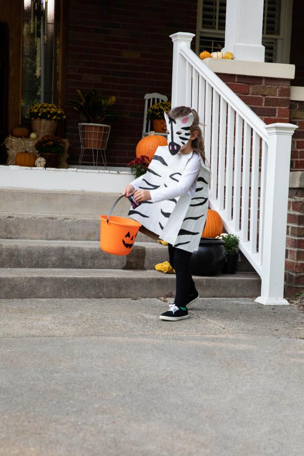 Girl in DIY Paper Bag Zebra Halloween Costume 