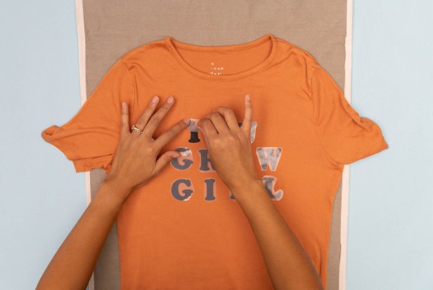 These letters are being ironed onto a t-shirt to create a houseplant Halloween costume.