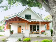 “Everyone thinks our house has been here for 100 years — exactly what we were going for when we built it (in 2016)," say homeowners Emily and Micah Baginski of their 2,956 sq. ft. house. "The standing seam metal roof and cedar-stained Douglas fir beams remind us of old California farmhouses, while the smooth stucco column bases give a modern touch.”

“Most of our yard is under the cover of a Japanese zelkova tree,” says Micah, “so I spent a lot of time scrolling through Pinterest for shade-tolerant plants.” He landed on patches of shaggy Japanese forest grass and spiky foxtail fern. Fortnight lilies border the concrete path and bloom ivory flowers from spring through fall.