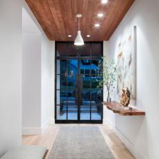 Contemporary Foyer With Wood Shelf