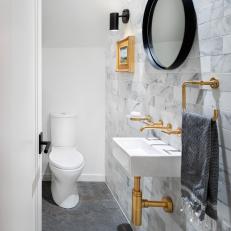 Contemporary Powder Room With Brass Faucet