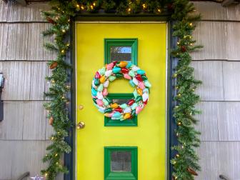 Vintage Christmas Bulb Light Wreath Hangs on Colorful Front Door