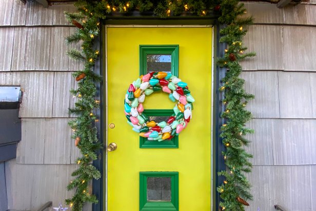 Vintage Christmas Bulb Light Wreath Hangs on Colorful Front Door
