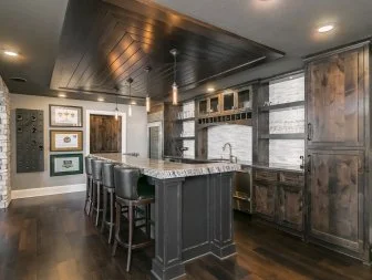 Beautiful Basement Kitchen in Dark Wood and Gray