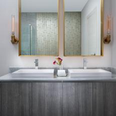 Gray Modern Bathroom With Gold Mirrors