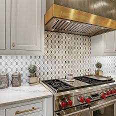 White Traditional Kitchen With Gold and Silver Hood