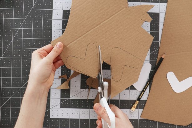 Cut out the V shapes from the first page of the pattern and trace them onto cardboard. Cut out as many branches as you would like (we used about 35 on our tree).